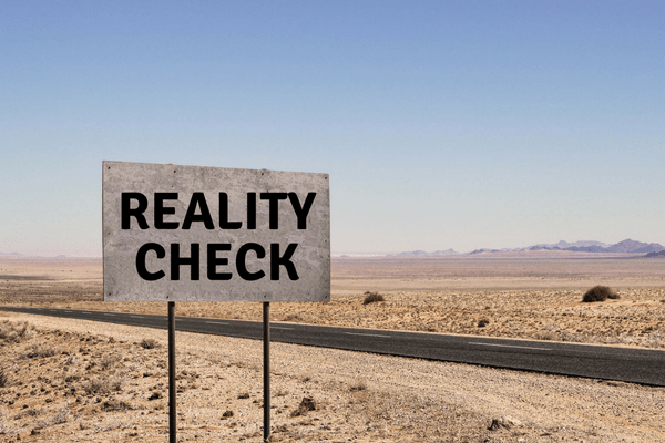 Road sign that says "Reality Check" - AB Car Guys